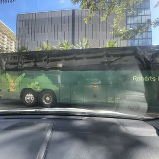 Bus blocking parking entrance to Ohana East Hotel Parking garage for over 10 minutes