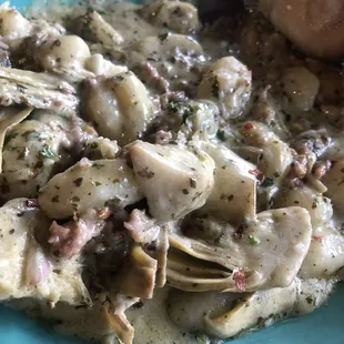 Gnocchi with artichoke and sausage sauce