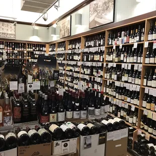 rows of bottles of wine on shelves