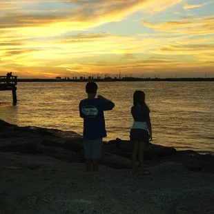 Sharing ice cream and a sunset near pier at Robert's Point Park