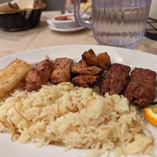 a plate of meat and rice