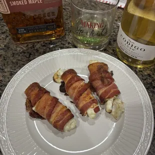 Bacon wrapped jalapeño poppers stuffed with cream cheese.