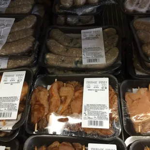 Marinated chicken skewers and sausages