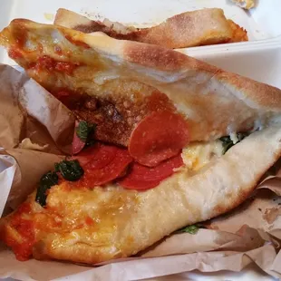 Limited amount of ingredients placed as close to the center as possible. 3-4 good (small) bites, every other bite is a mouthful of bread.
