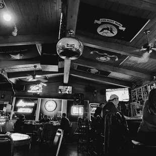 a black and white photo of a bar