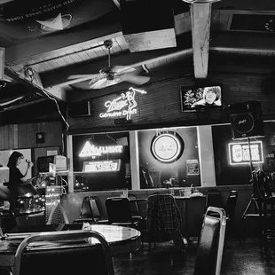 a black and white photo of a bar