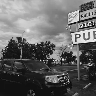 a car parked in front of a pub