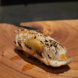 Black snapper belly with black peppercorn, caramelized onion puree