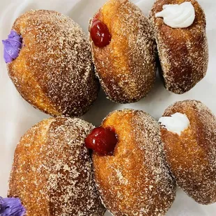 Hot of the fryer Malasadas!!  Ube, guava, coconut creme