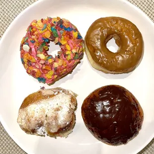 Fruity pebbles doughnut, maple covered, chocolate covered cream filled, and a cream cheese kolach (similar to a cheese danish)