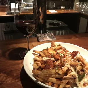 My friend's poutine ; He gave it a