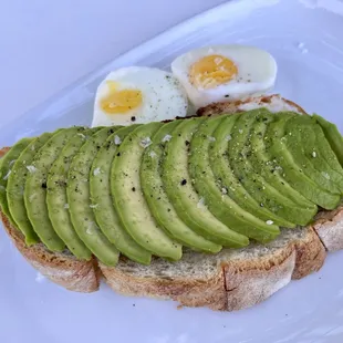 an avocado toast with eggs