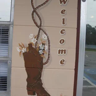 a cowboy boot painted on the side of a building