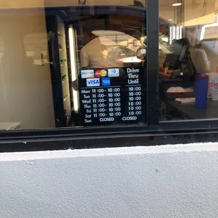 Hours posted at the drive thru