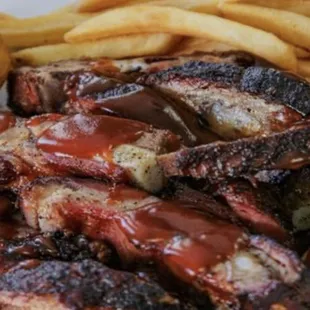 Barbecued Pork Ribs, French fries and corn bread.