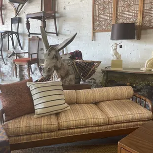 Very cool piece...wooden base with soft cushions for a more formal sofa