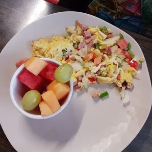 Scrambled egg omelet and fruit bowl