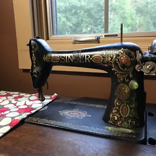 A vintage sewing machine at the treetop