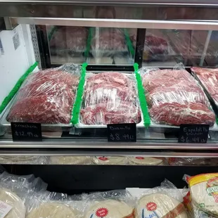 a display of meat in a case