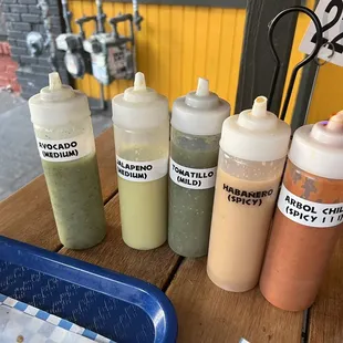 a variety of condiments on a table