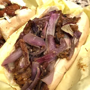 two hot dogs with onions