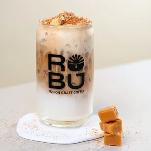 Vienna Einspanner Latte, a delightful blend of strong espresso, semi-sweet cream, and a dusting of cocoa powder.