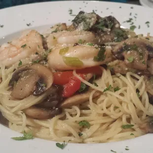 Shrimp and pasta with mushrooms and peppers.