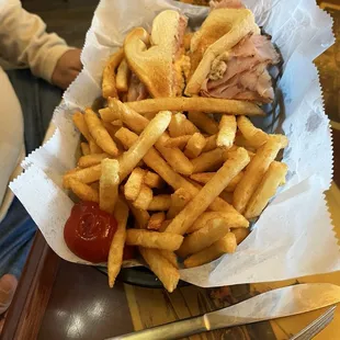 Club sandwich with fries