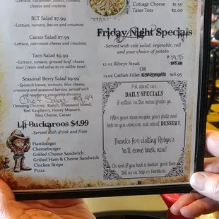 a person holding a menu in their hand