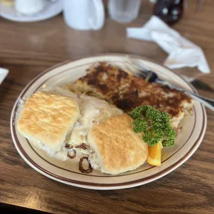 Housemade Biscuits: Smoked chicken sausage gravy, caramelized onions, eggs and hash brown.
