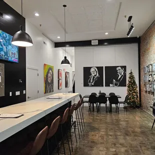 a long bar with chairs