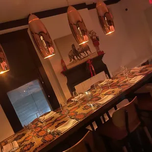 a long table with plates and glasses on it