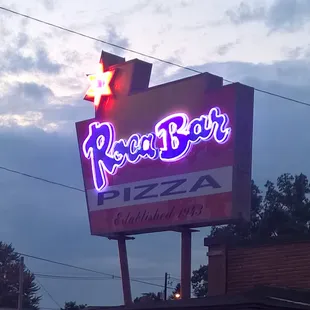 a neon sign for a restaurant
