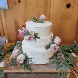 Cake table - displayed up on wine barrels.