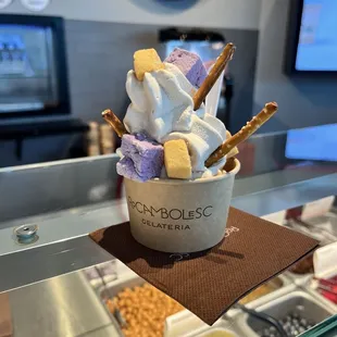 Peanut butter gelato, topped with butter cookies, pretzel and violet marshmallows