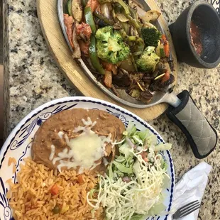 two plates of mexican food on a table