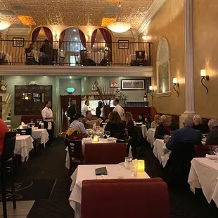people sitting at tables in a restaurant