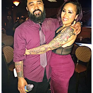 a man and woman posing for a picture