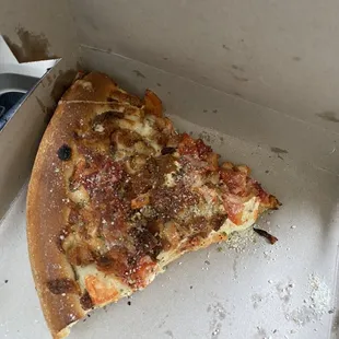a slice of pizza in a box