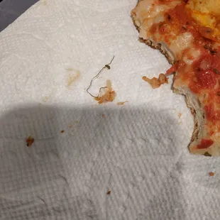 piece of metal inside the pizza that I chewed