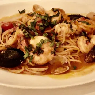 a plate of pasta with seafood