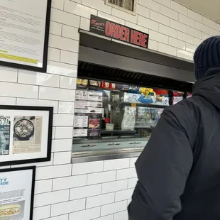 a man standing in front of the counter
