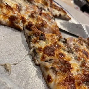 White pizza with sausage, mushroom and onion