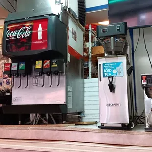 a vending machine and a soda dispenser