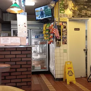 a small kitchen with a television