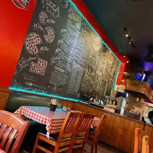 a restaurant with a chalkboard menu