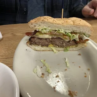 Bruno&apos;s Bacon Cheeseburger it&apos;s fresh &amp; delicious It&apos;s 1/2 of the burger my husband Wolf half of it before I could take the picture lol.