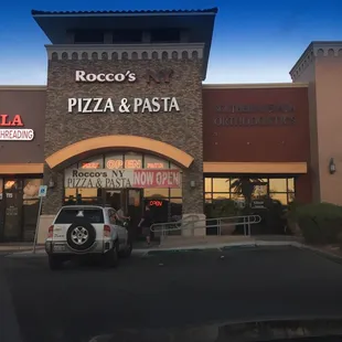 a car parked in front of the restaurant