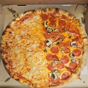 Half and half pineapple on  left and pepperoni mushroom on right