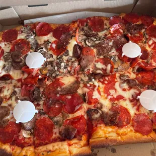 Sicilian style with mushrooms, sausage, and pepperoni.